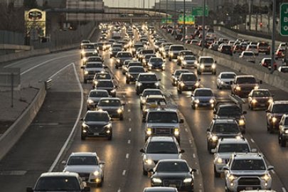 Many cars on a highway.